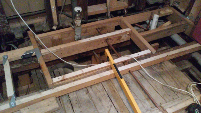 New structural support to help those old floor joists.